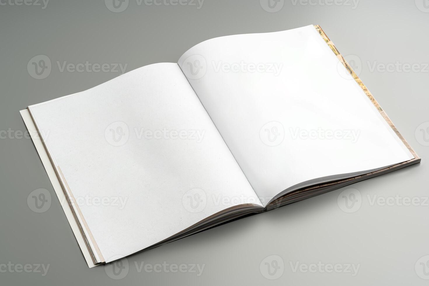 A blank open notebook resting on a neutral background during daylight photo