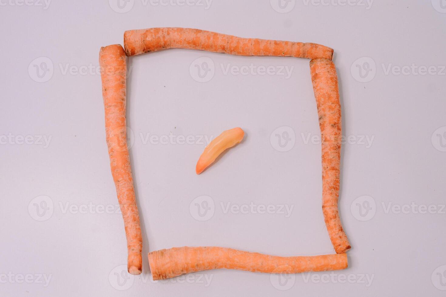 Fresh carrots displayed against a clean white background, highlighting their vibrant orange color and crisp texture photo