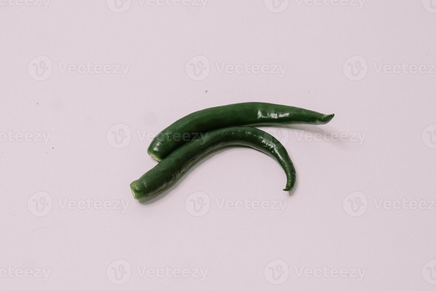Large green chili peppers arranged artistically, showcasing their fresh and vibrant appearance photo