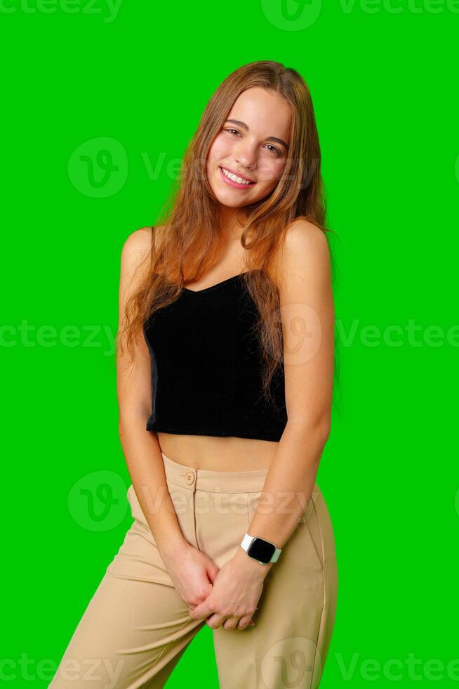 Smiling Young Woman in Black Top and Tan Pants Portrait photo