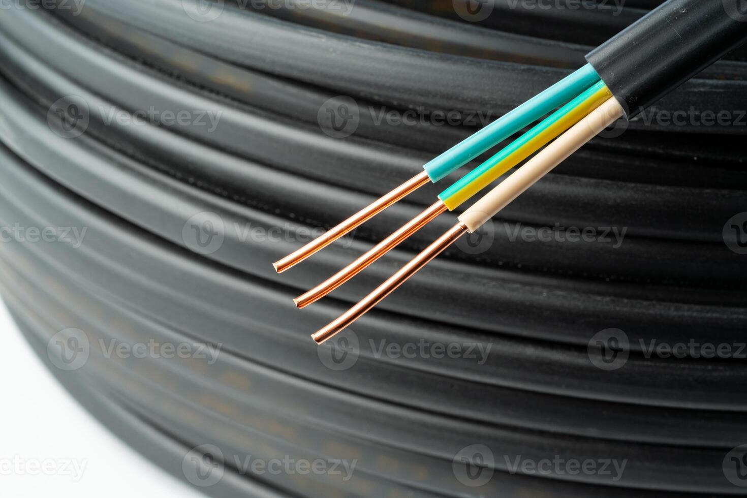 Close Up Of Black Electrical Wire Coil With Blue And White Wires photo