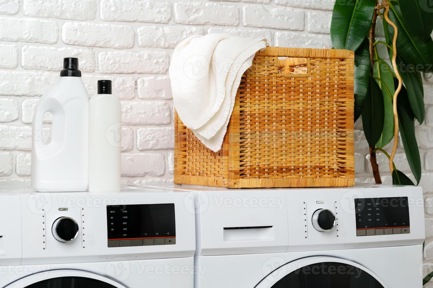 White Laundry Appliances in a Modern Bathroom With White Brick Wall photo