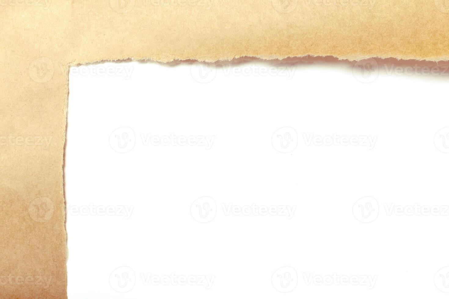 Brown package paper torn to reveal white panel photo