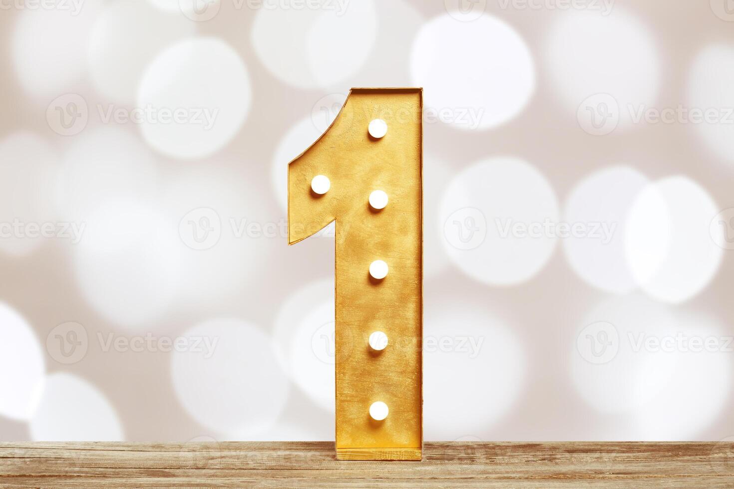 Big plastic numbers with shining light bulbs photo