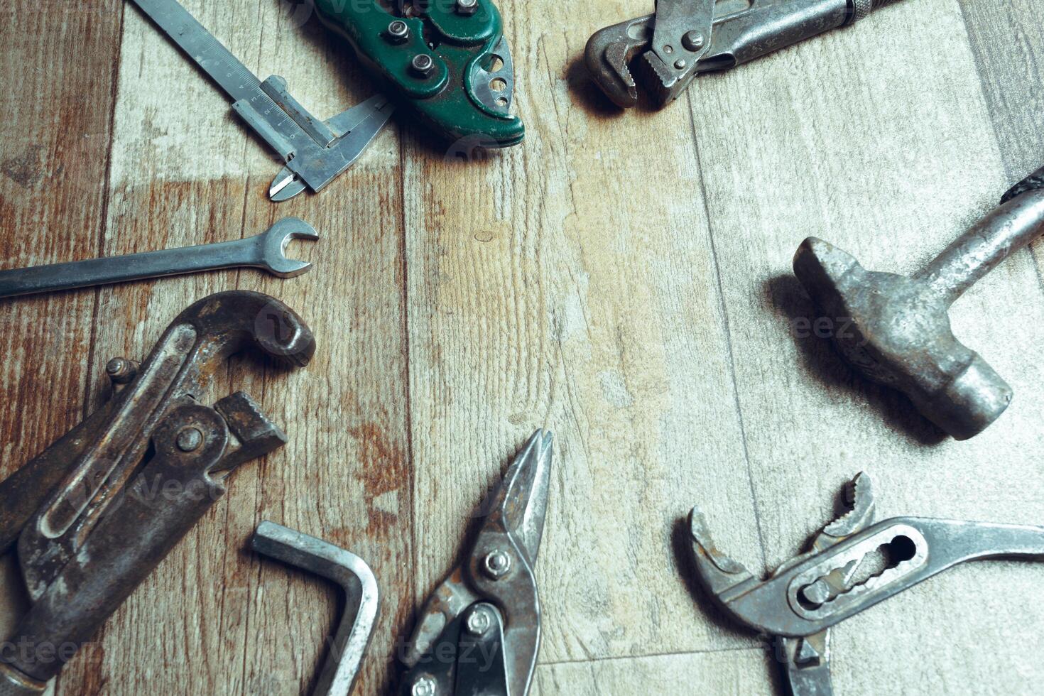 Working tools on wooden rustic background. top view photo