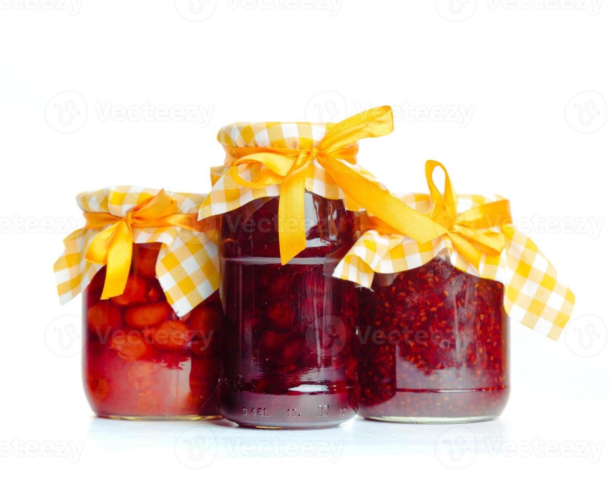 Glass jar with jam isolated on the white background photo