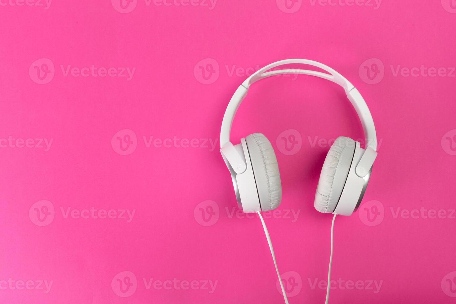 headphones on pink background photo