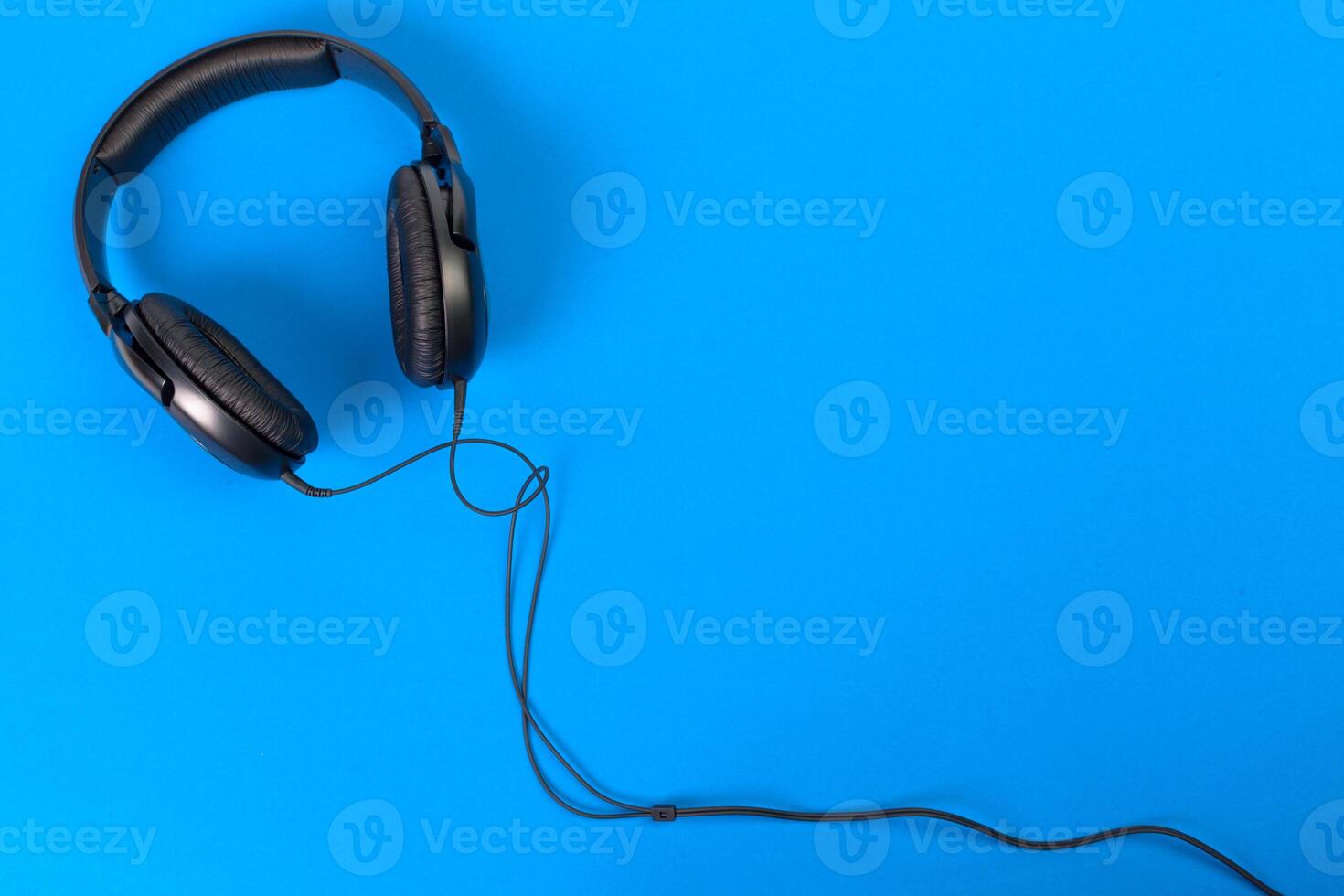 Headphones on blue background photo