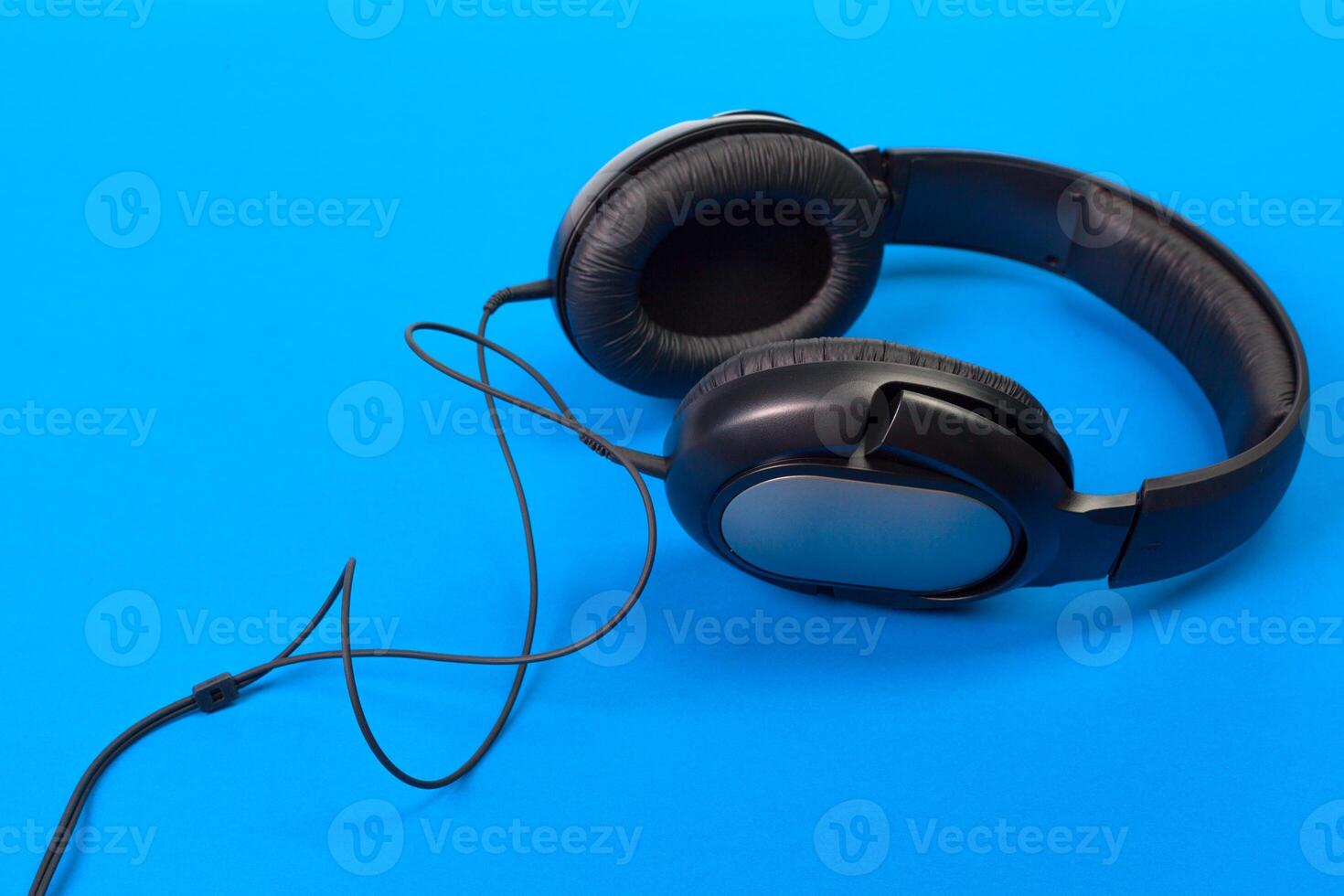 Headphones on blue background photo