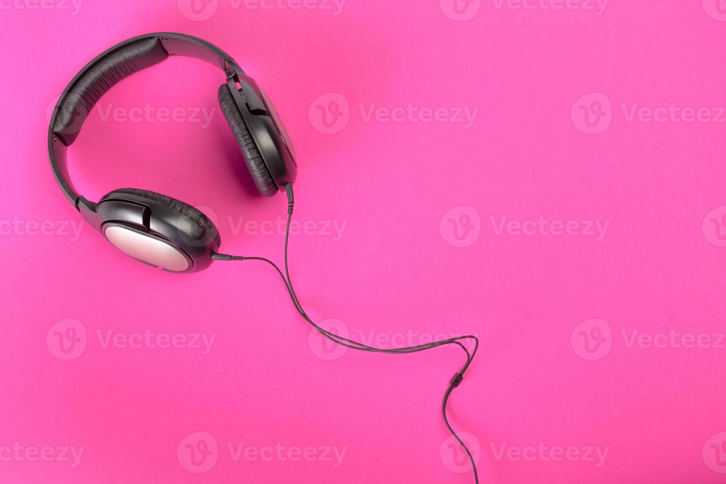 headphones on pink background photo