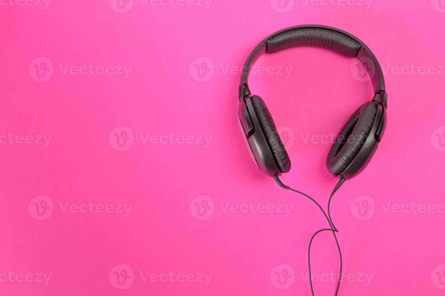 headphones on pink background photo