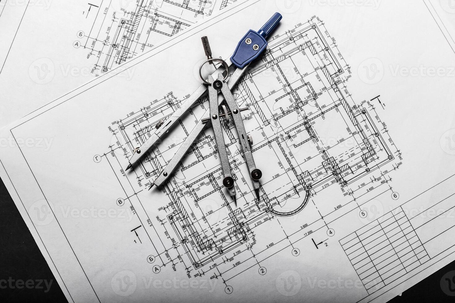 Construction planning drawings on black background photo