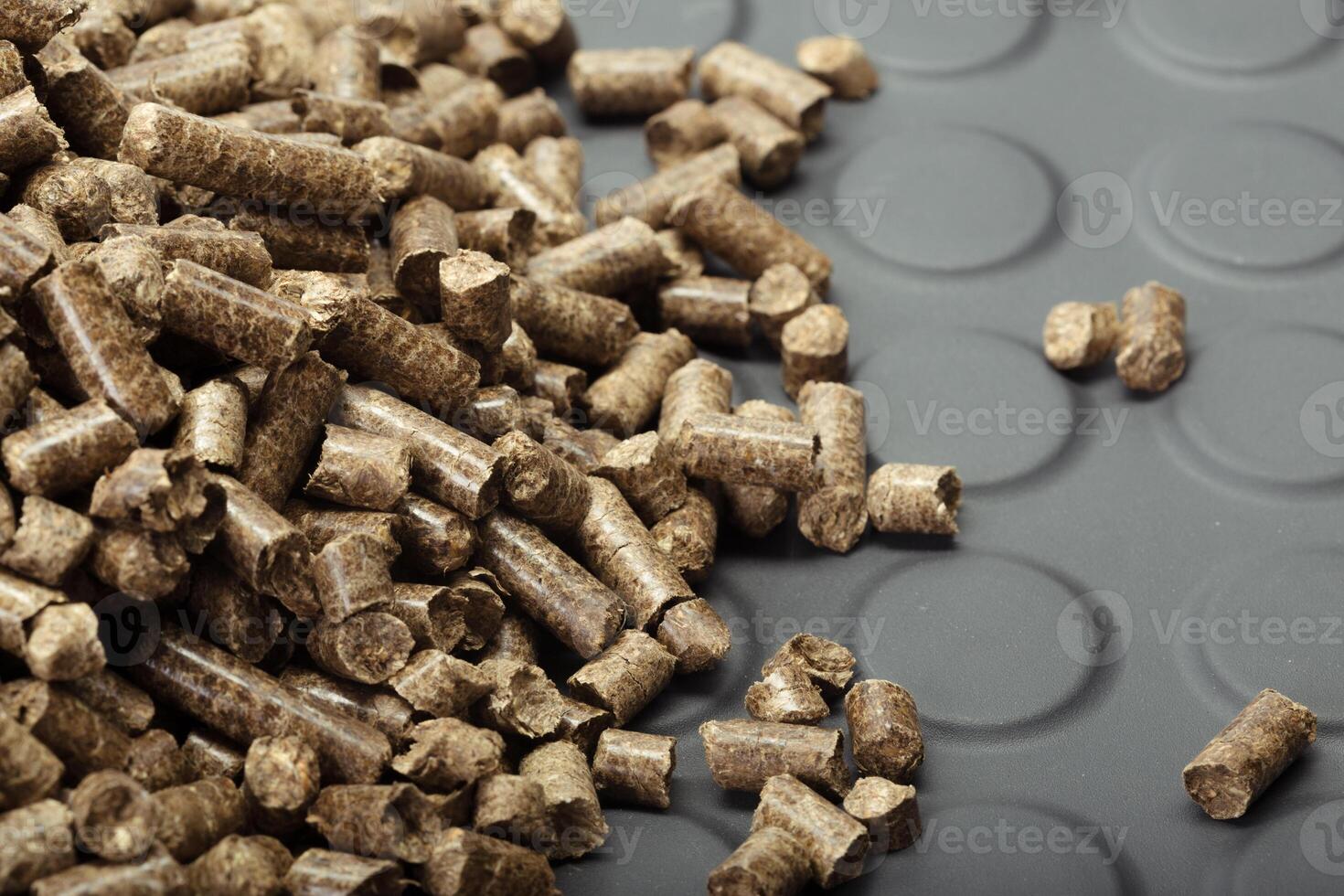 Wood pellets in the background. photo