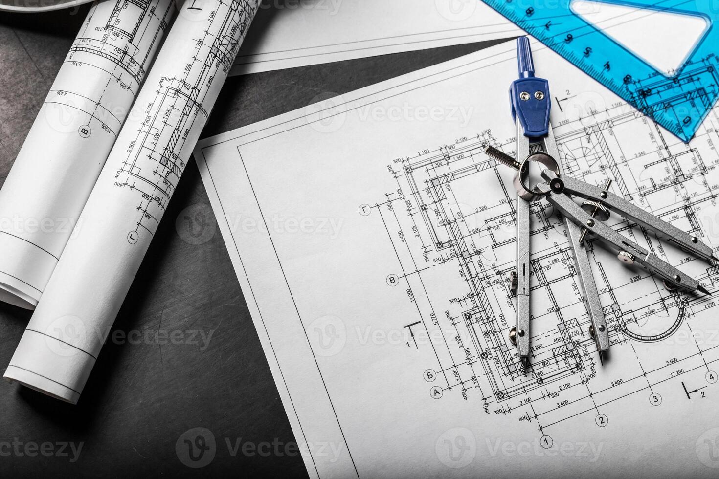 Construction planning drawings on black background photo