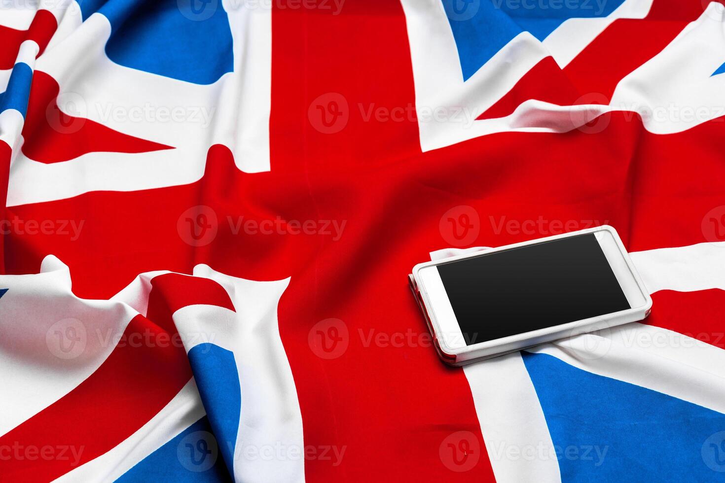 smart phone or cell phone over United kingdom flag photo