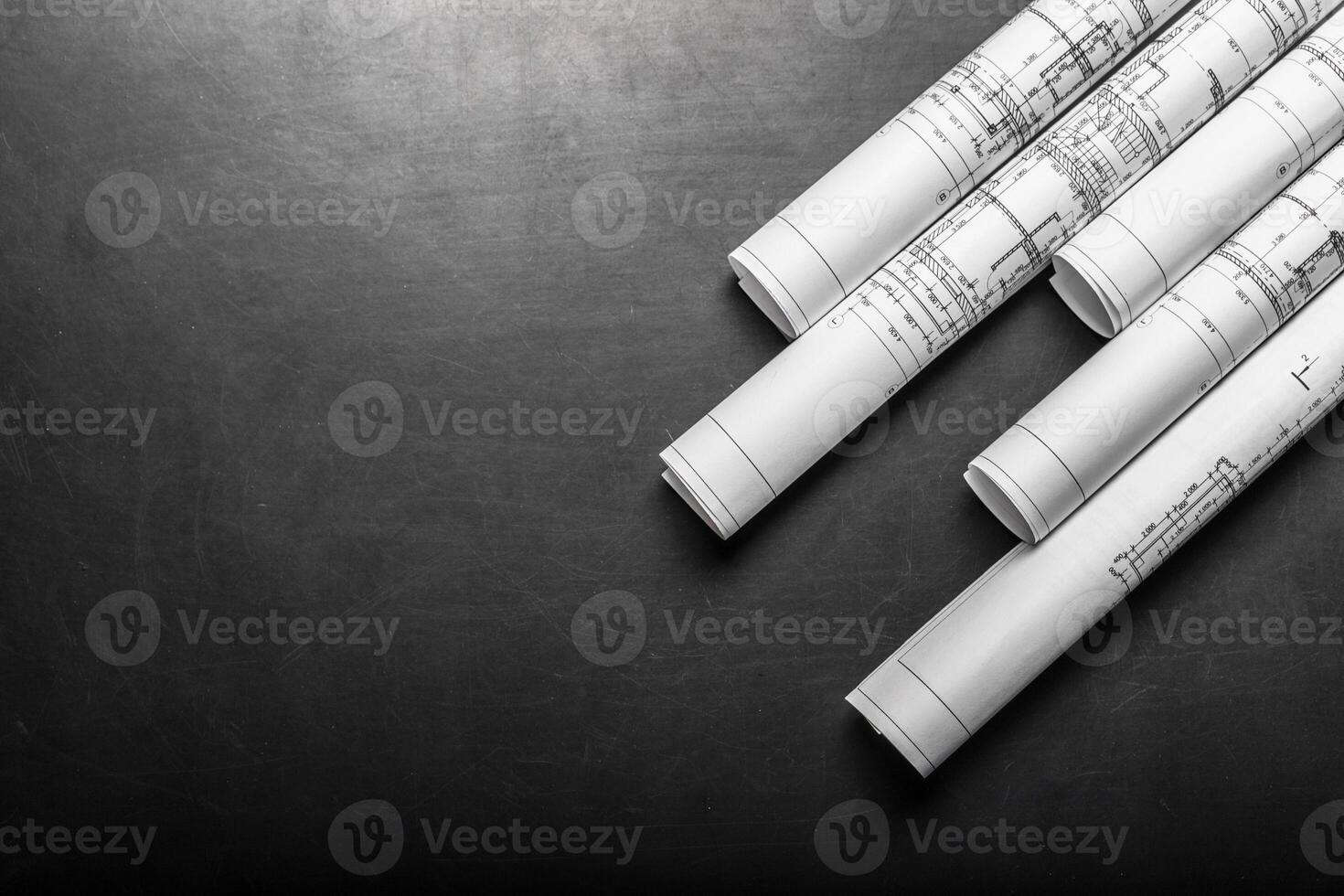Construction planning drawings on black background photo
