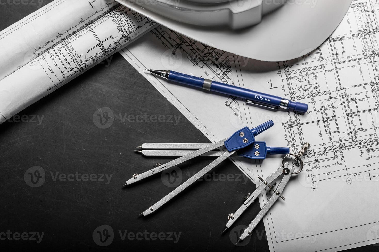 Construction planning drawings on black background photo