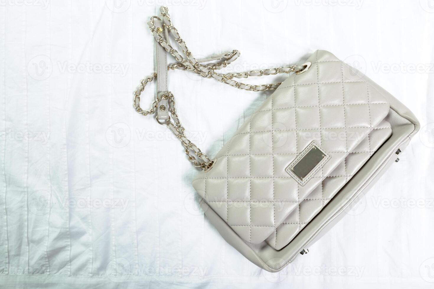 Female bag on white textile photo