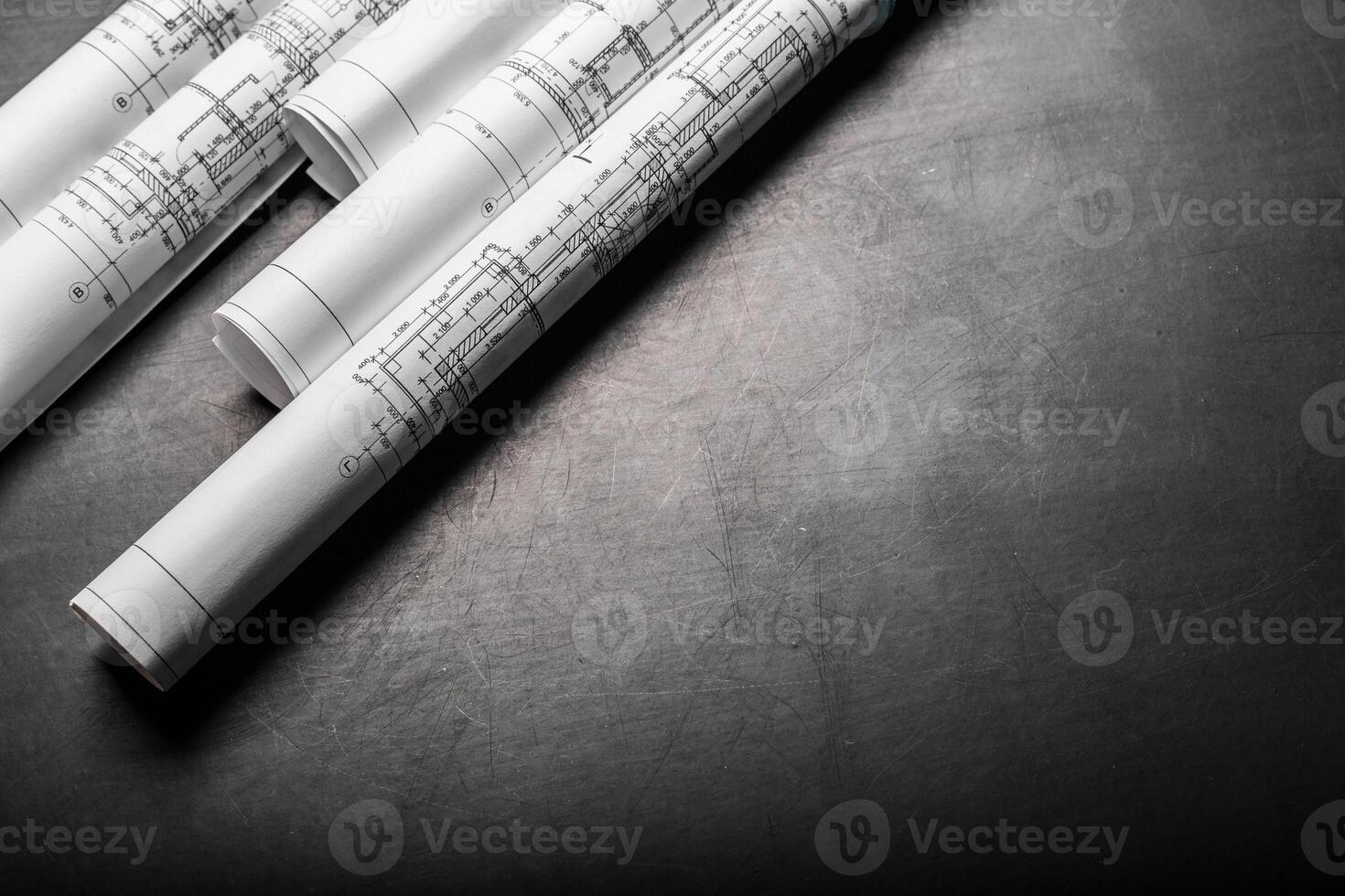 Construction planning drawings on black background photo
