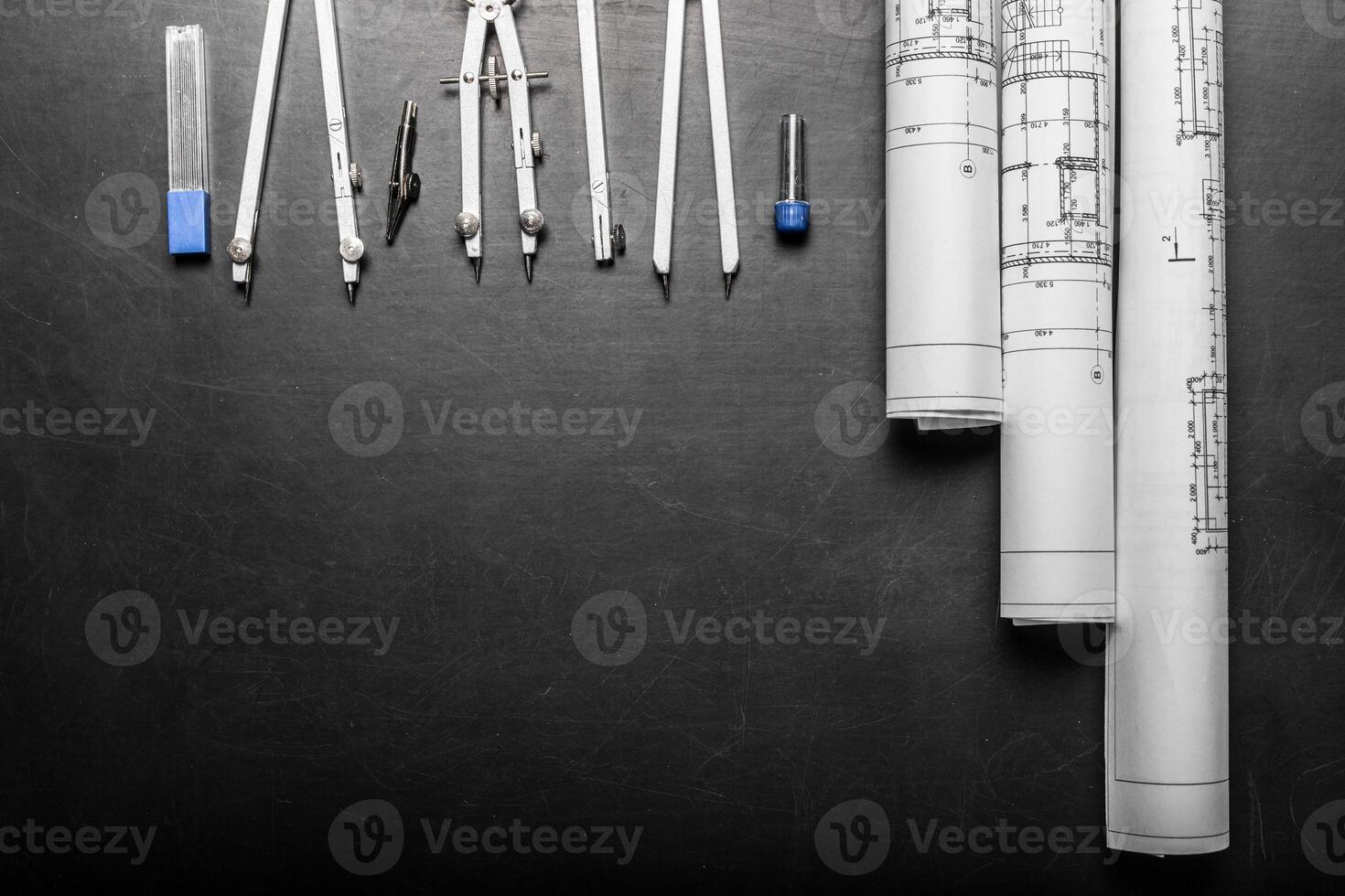 Construction planning drawings on black background photo