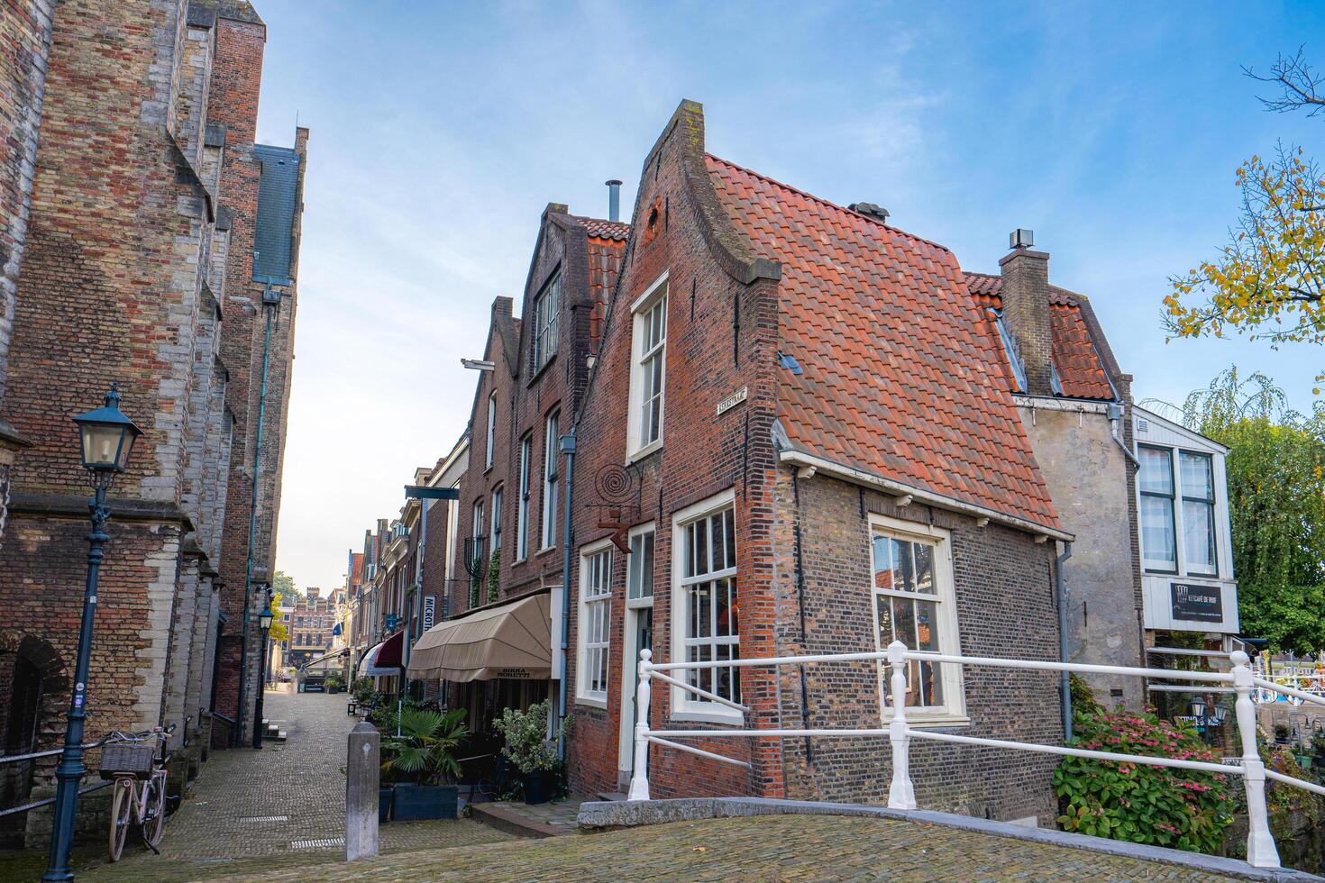 Delft, The Netherlands October 15, 2024. The old houses and canals in Delft. photo