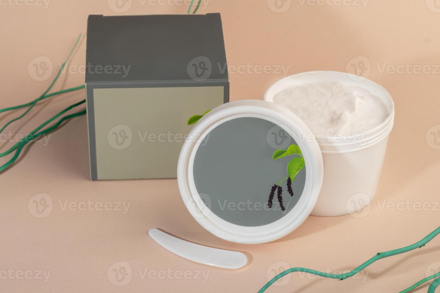 Face mask with spatula on light background. Cosmetic procedures. photo