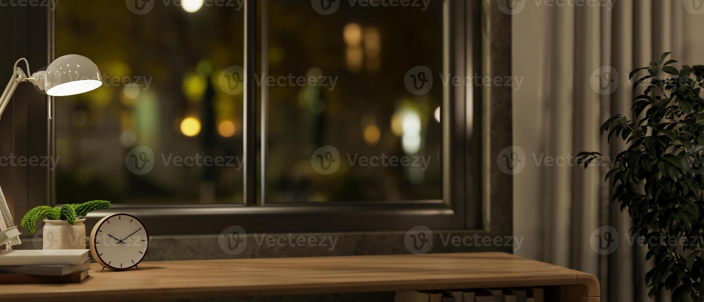 A close-up of a space on a wooden table against the window in a cozy room at night. photo