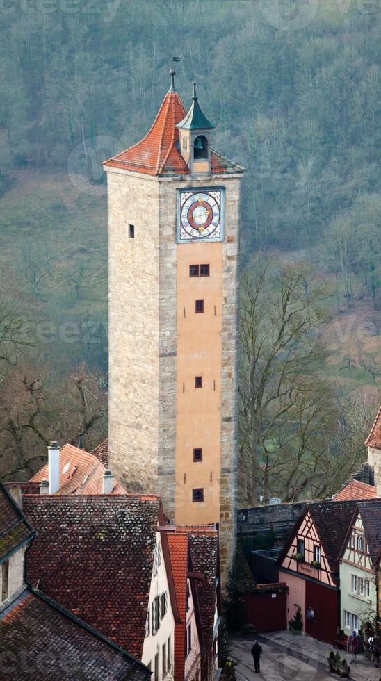 A tall tower with a clock on it photo