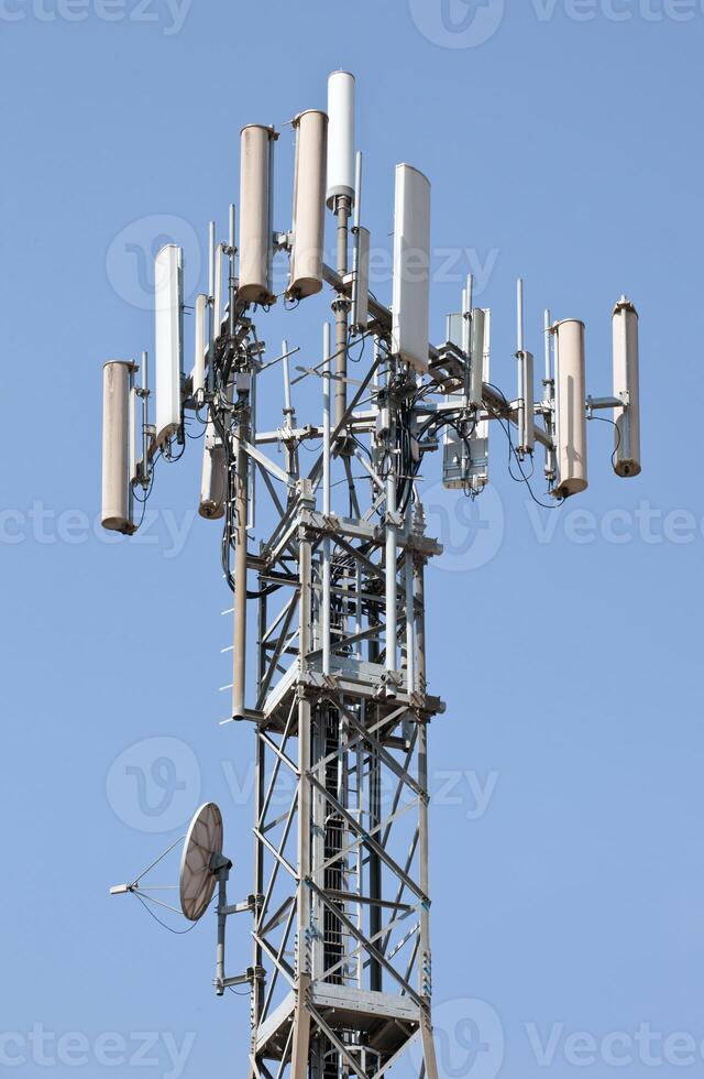 A tower with many antennas on it photo