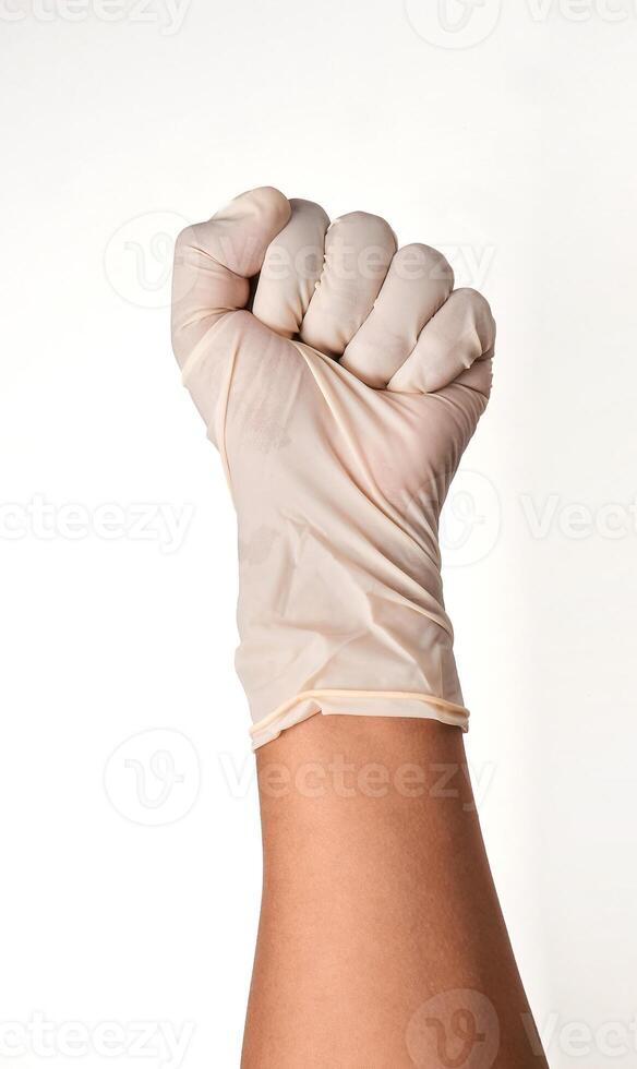 Latin doctor's hand glove showing fist on white background. photo