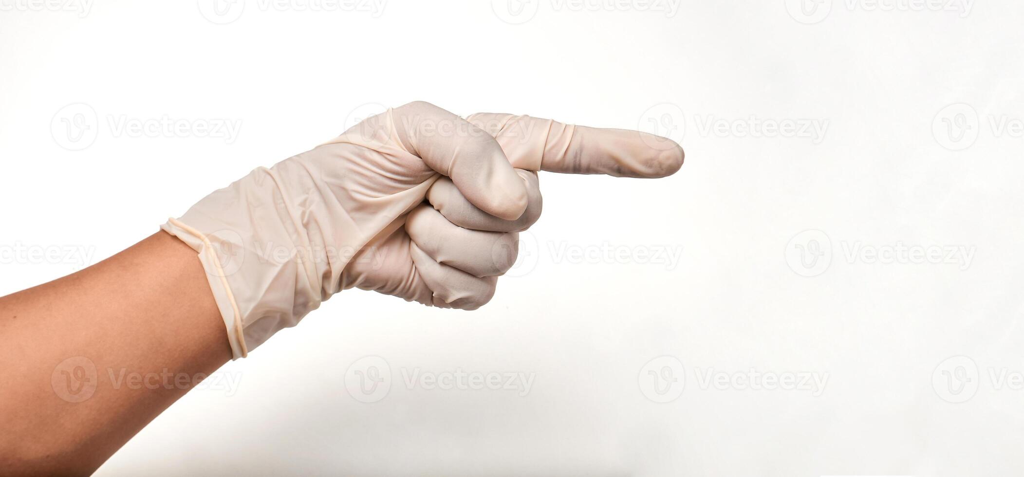 Latin doctor's hand in glove pointing on a white background. photo
