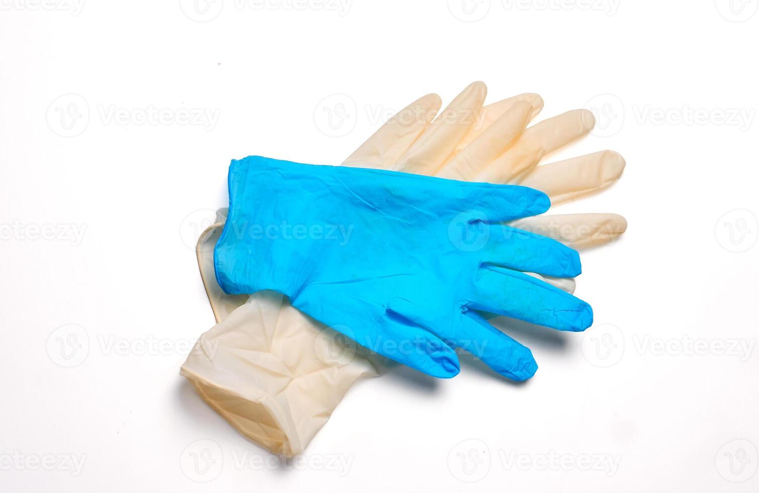 Different protective gloves on white background, top view. Medical item photo