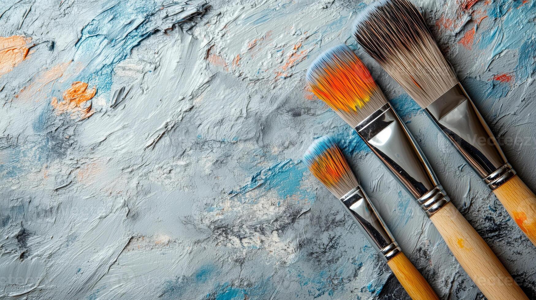 Creative flat lay composition with paint brushes on light grey background photo