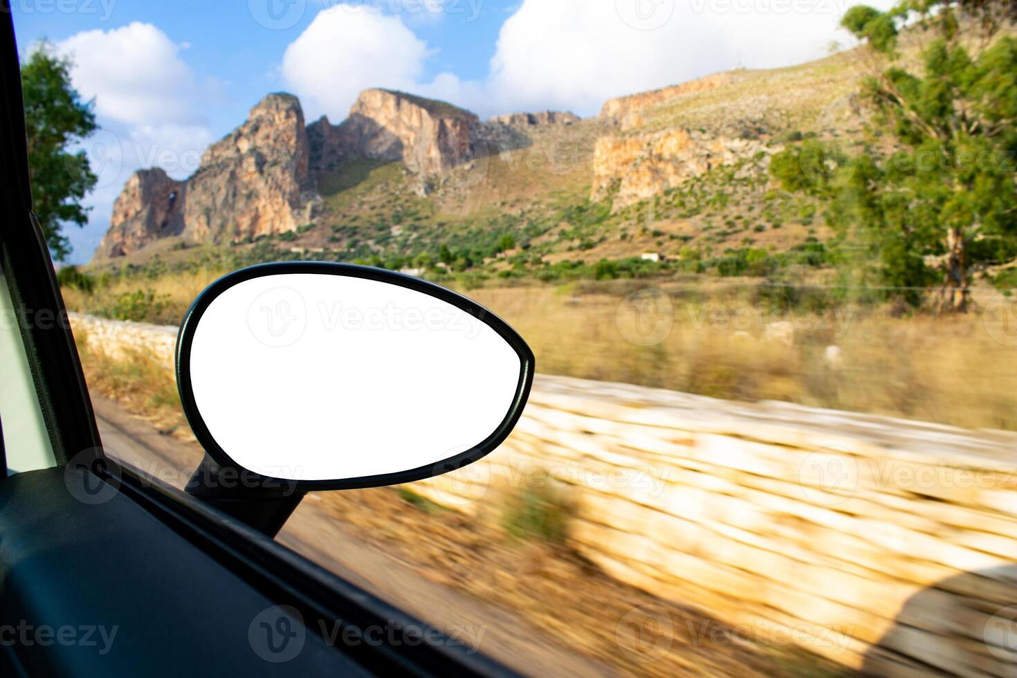 A view of a mountain range from a car window photo