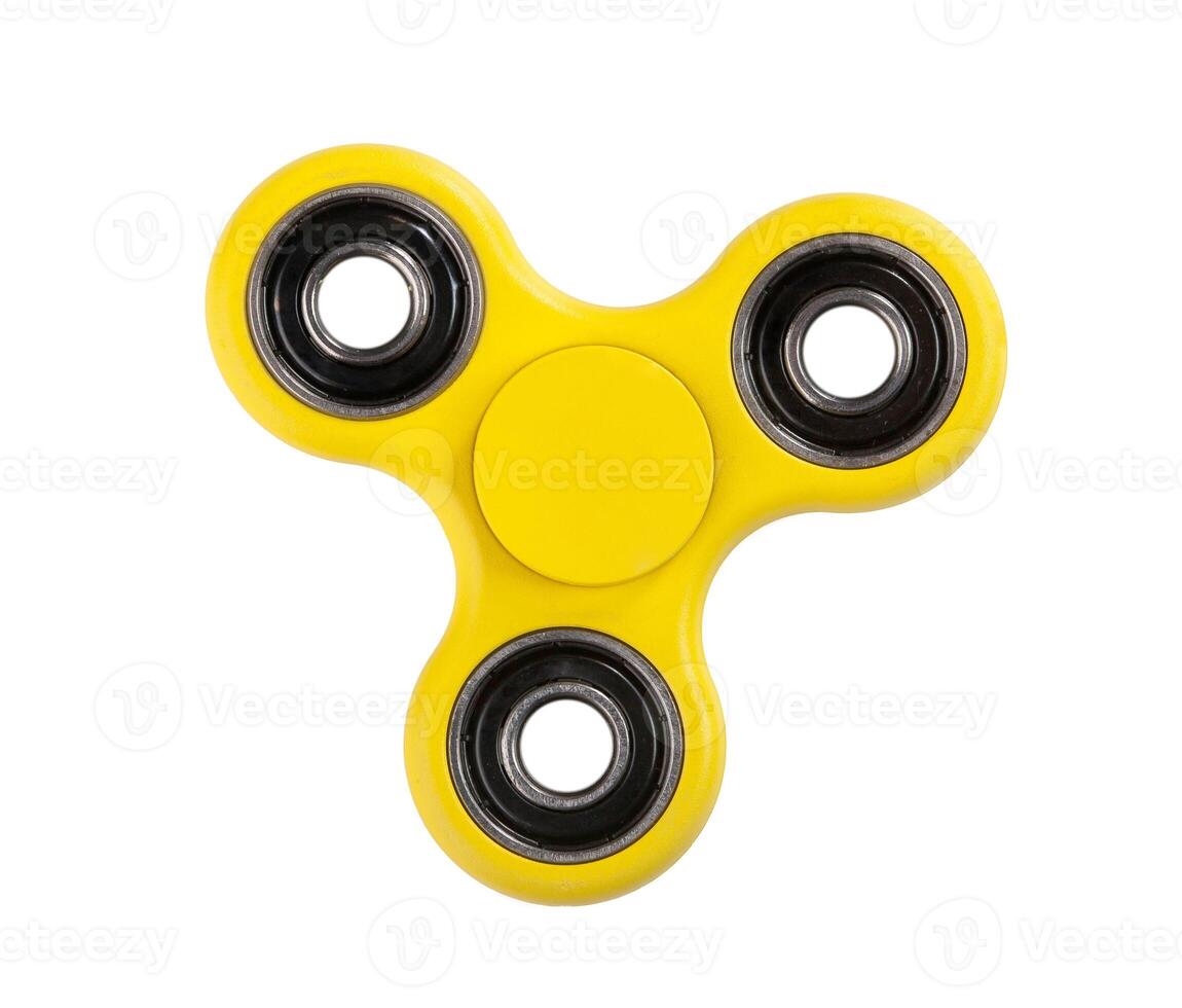 Yellow Fidget Spinner on white background photo