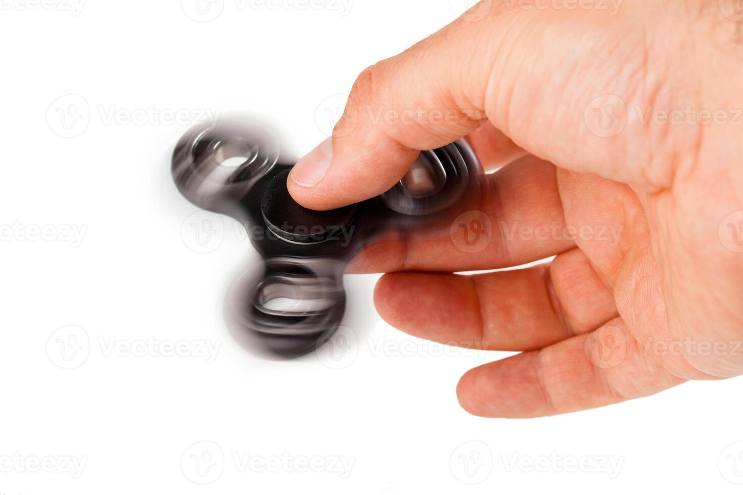 Palying with a Black Fidget Spinner photo
