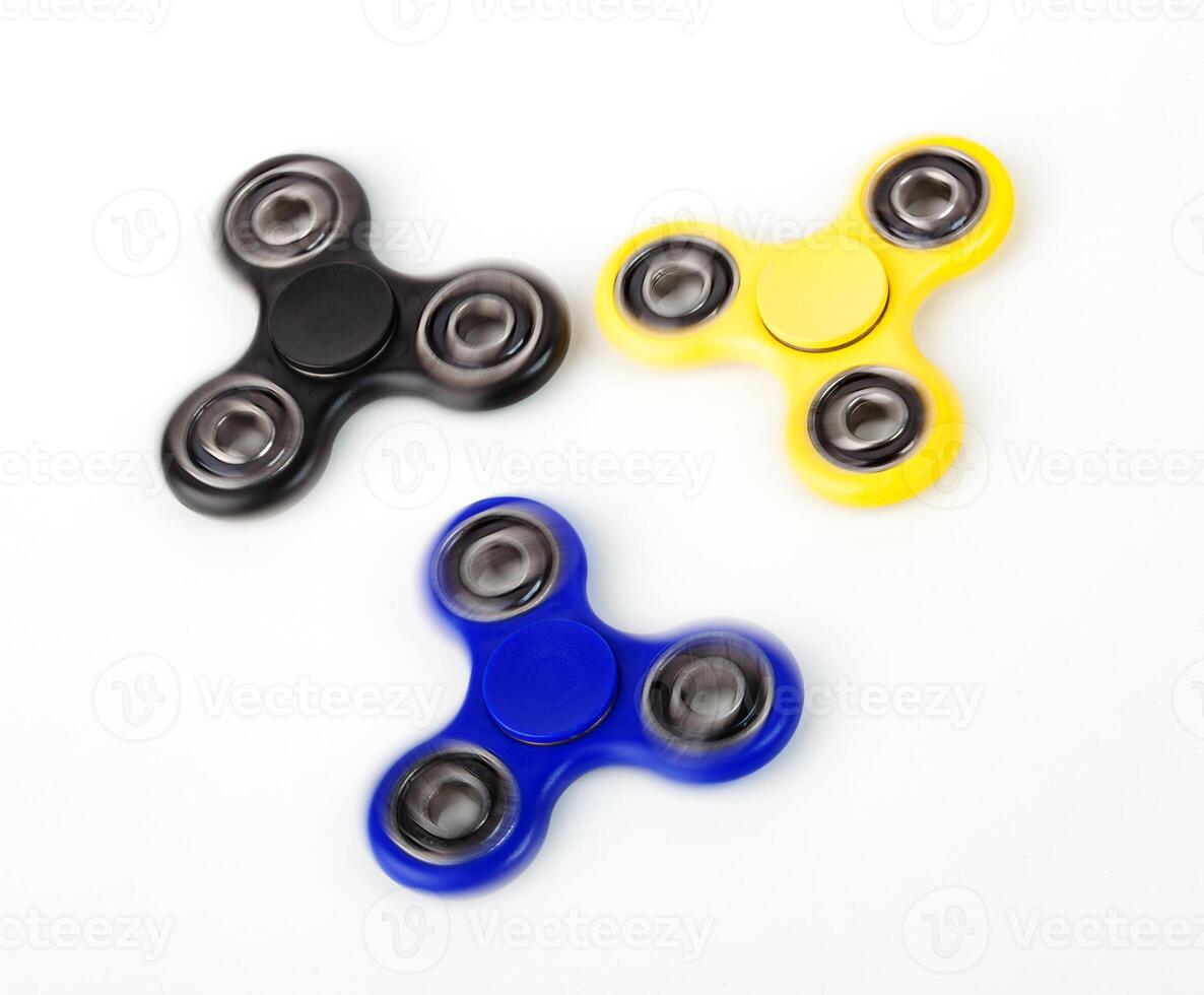 Three Fidget Spinner on white background photo