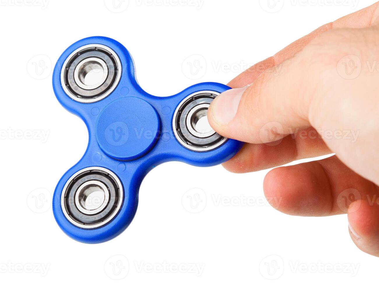 Playing with a blue Fidget Spinner photo