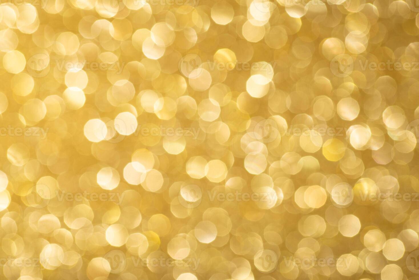 Glittering golden bokeh abstract background photo