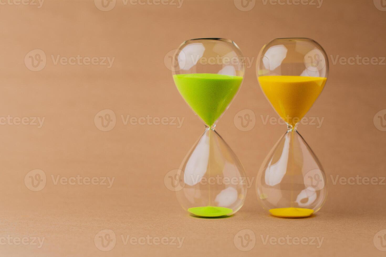 Hourglass, a timepiece, the rules of time and the rush of work, the value and meaning of time photo