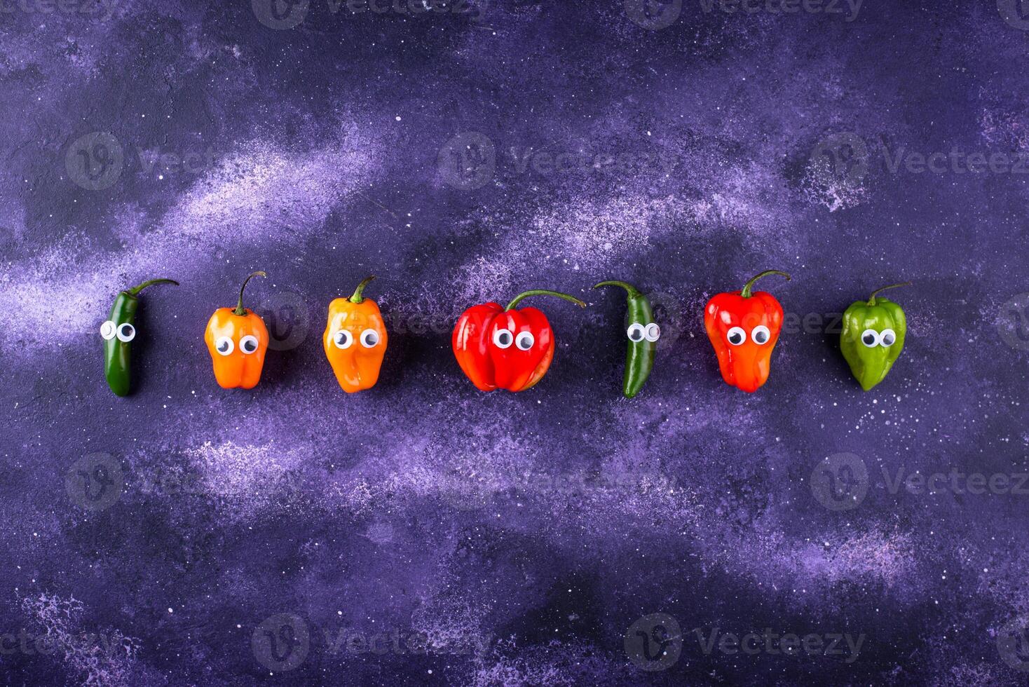 Cute color bell pepper with eyes. photo