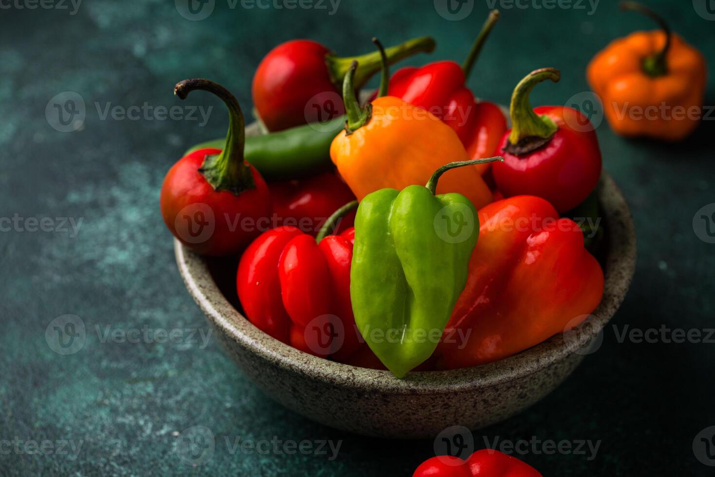 Colorful peper on green background photo