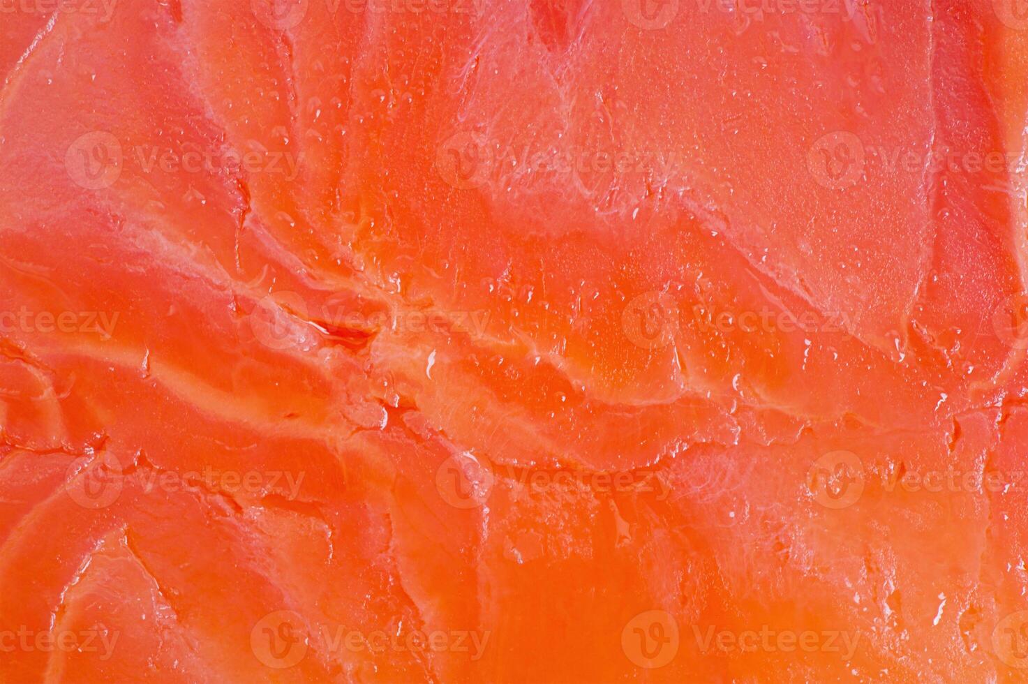 Red salmon fish fillet macro photo as background. Texture of fish fillet.