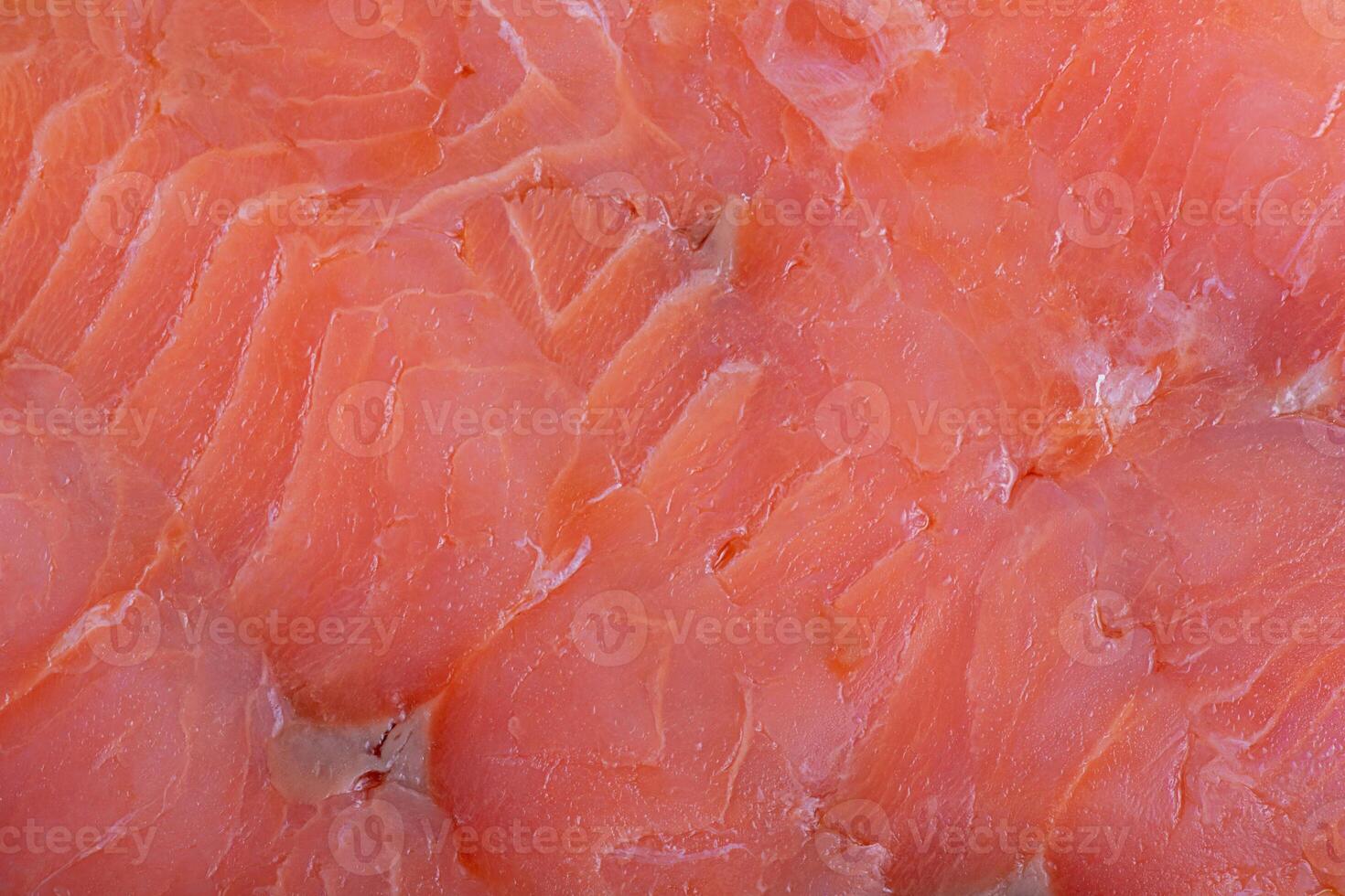 Red salmon fish fillet macro photo as background. Texture of fish fillet.