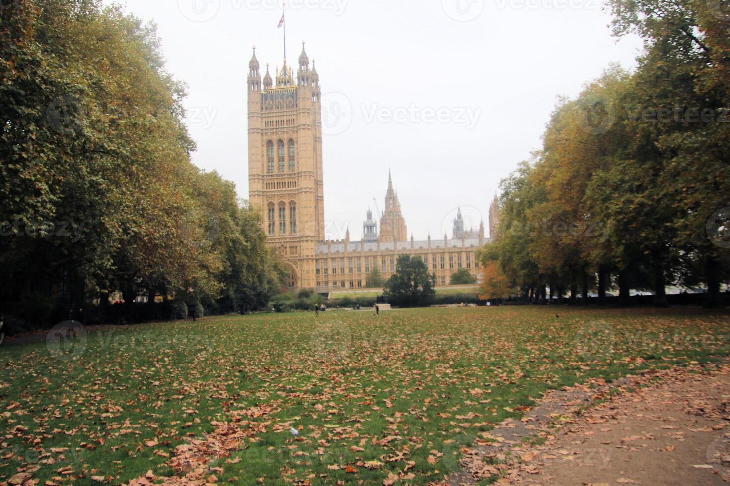A large building with a clock tower in the background photo