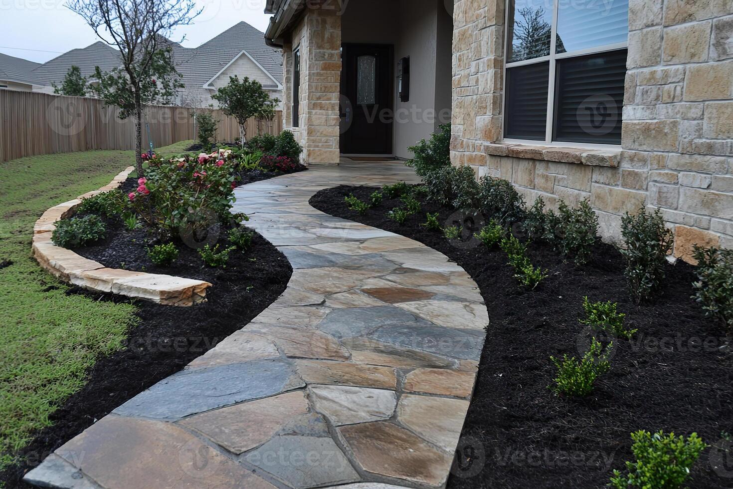closeup photo of installing a stone pathway leading to the front door