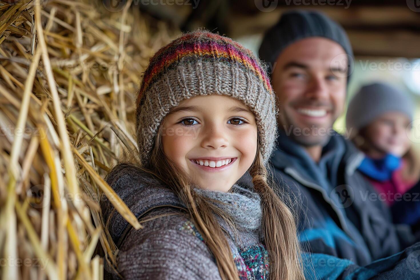 Family enjoys a joyful hayride surrounded by vibrant autumn leaves photo