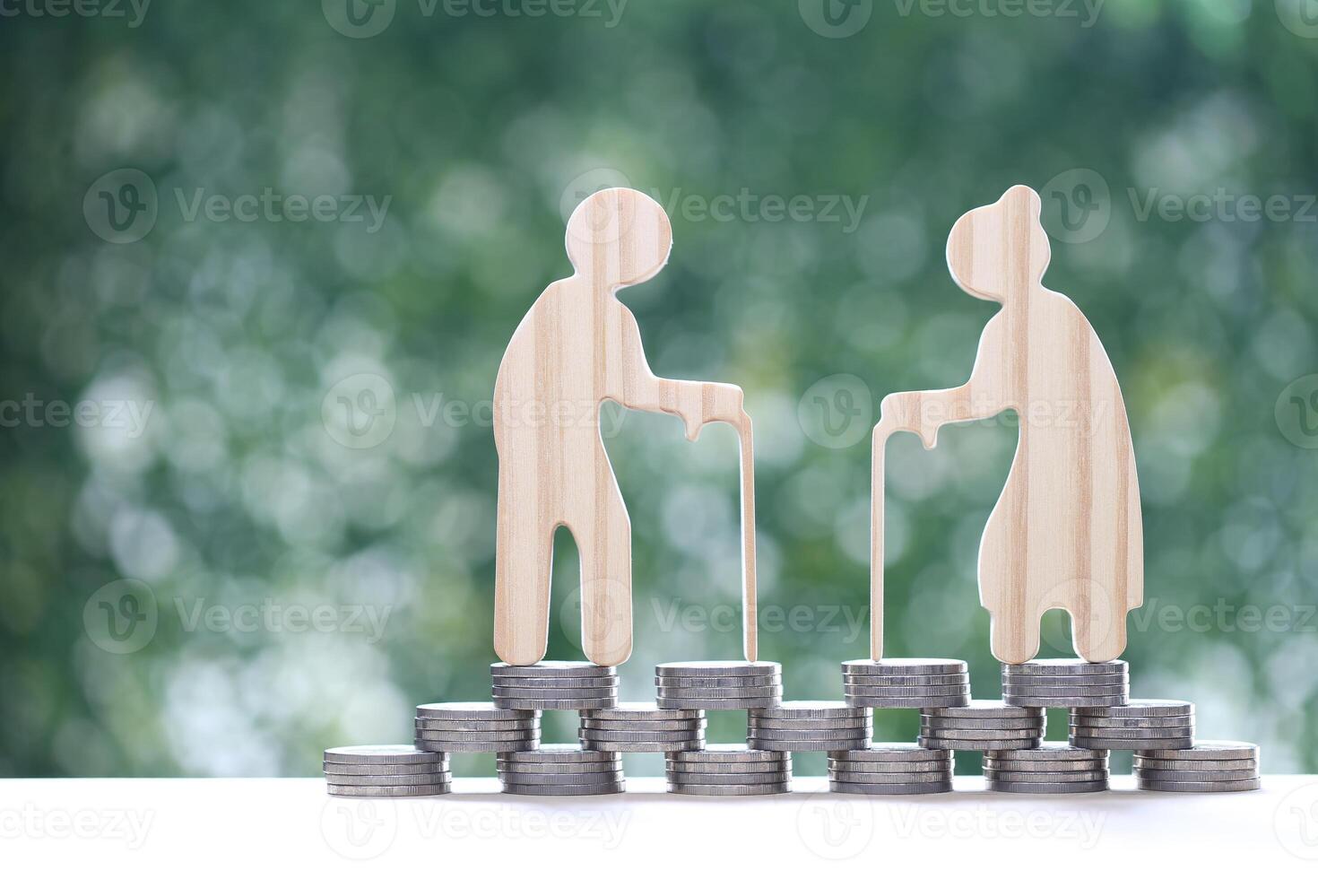 Mutual fund,Love couple senior and stack of coins money on natural green background, Save money for prepare in future and pension retirement concept photo