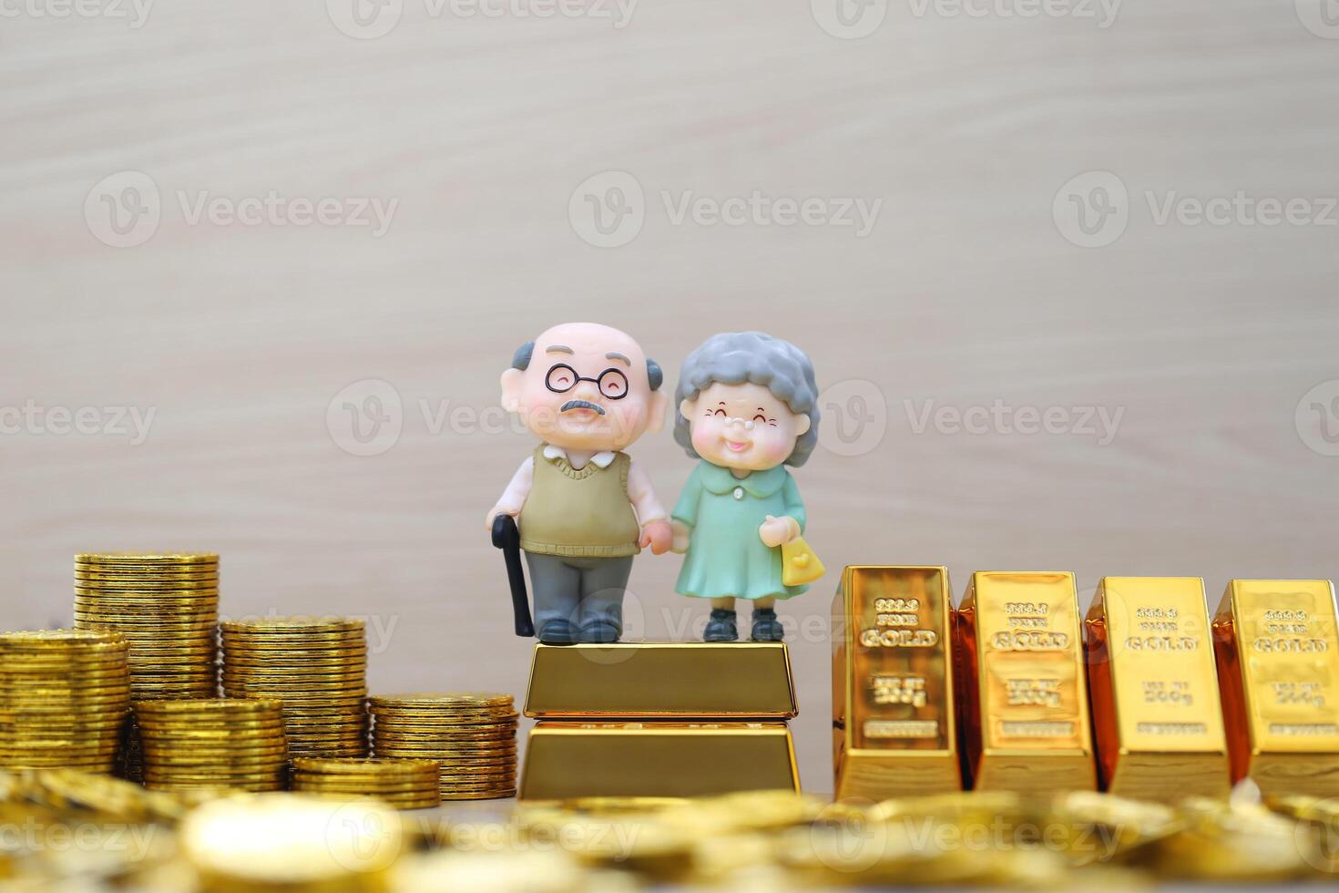 Mutual fund,Love couple senior on gold bar and stack of gold coin money on wooder background, Save money for prepare in future and pension retirement concept photo