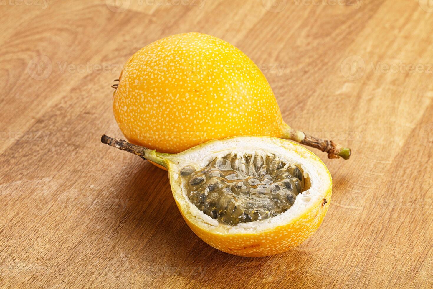 Yellow granadilla with cut half photo